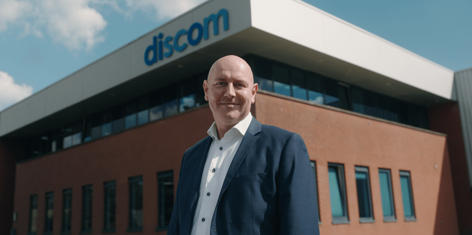 Werner van Well, Account Manager at Discom in front of office